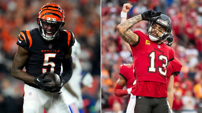 Tee Higgins yells in celebration holding the football; Mike Evans salutes
